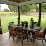 Screened Porch Dining Area with Outdoor Views