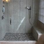 New modern shower with bench seating.