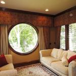 Beautiful Window Treatments Encasing Porthole Window Overlooking Lake Loudon